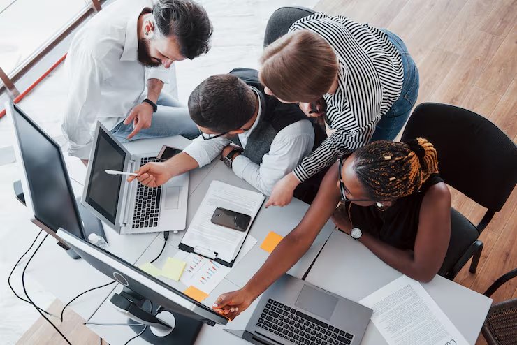 The Southline Management team reviewing reports together at a shared desk